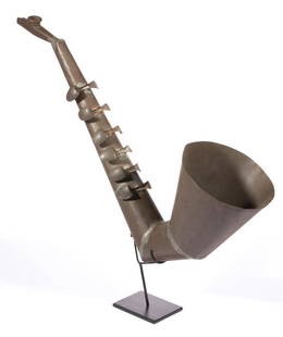 AMERICAN FOLK ART 10TH ANNIVERSARY TIN SAXOPHONE WHIMSY: AMERICAN FOLK ART 10TH ANNIVERSARY TIN SAXOPHONE WHIMSY, constructed of soldered sheet tin, small spoons, and a kazoo. Custom-made display stand. Fourth quarter 19th/early 20th century. 21 1/2"