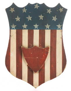 AMERICAN FOLK ART PAINTED POPLAR PATRIOTIC SHIELD: AMERICAN FOLK ART PAINTED POPLAR PATRIOTIC SHIELD PLAQUE, retaining an outstanding original dry painted surface. Possibly Centennial. Fourth quarter 19th century. 15 3/4" HOA, 11 1/2" WOA.Excellent