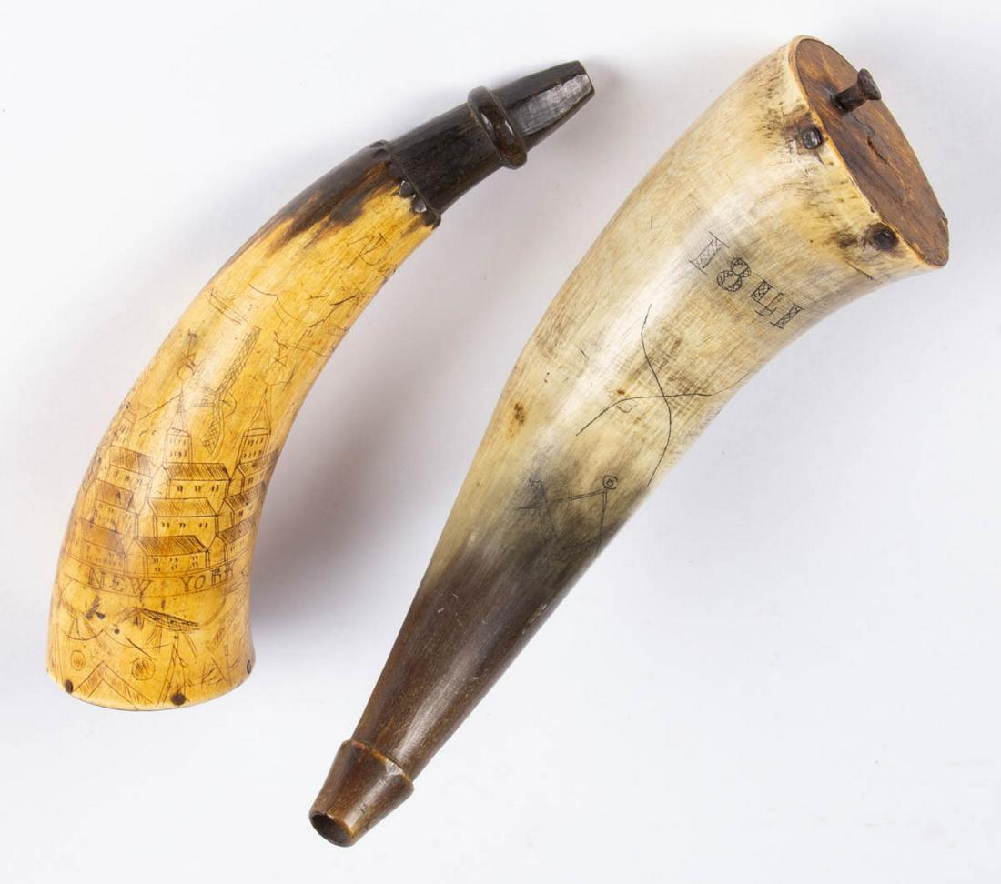 AMERICAN FOLK ART SCRIMSHAW-DECORATED POWDER HORNS, LOT: AMERICAN FOLK ART SCRIMSHAW-DECORATED POWDER HORNS, LOT OF TWO, each having a carved spout and a wooden cap, comprising one example with detailed decoration of various figures, animals, and guns surro