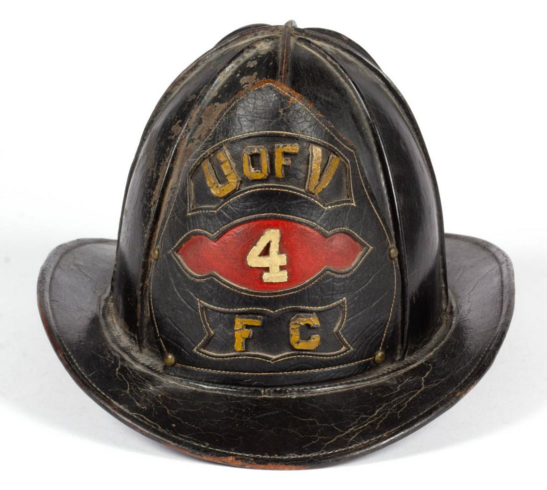 UNIVERSITY OF VIRGINIA LEATHER FIREMAN'S HELMET: UNIVERSITY OF VIRGINIA LEATHER FIREMAN'S HELMET, standard bend, featuring eight comb/panel body, front shield "U OF V / 4 / FC". Original surface. Circa 1900. 6 1/4" H, 12 3/4" LOA. Very good as-found