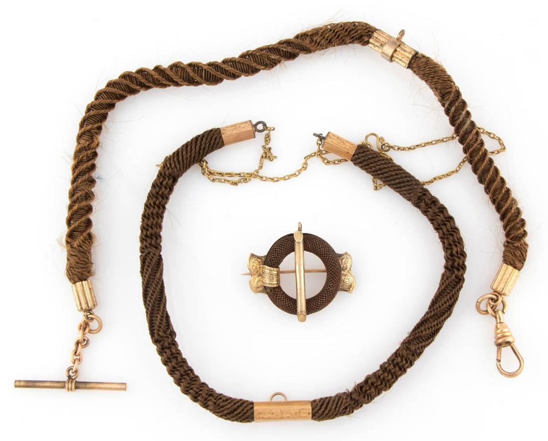 VICTORIAN HAIR-WORK MOURNING JEWELRY, LOT OF THREE: VICTORIAN HAIR-WORK MOURNING JEWELRY, LOT OF THREE, each featuring finely woven brown hair and gold-filled hardware, comprising a round-form brooch, a watch chain with a bar fob and an Albert swivel c