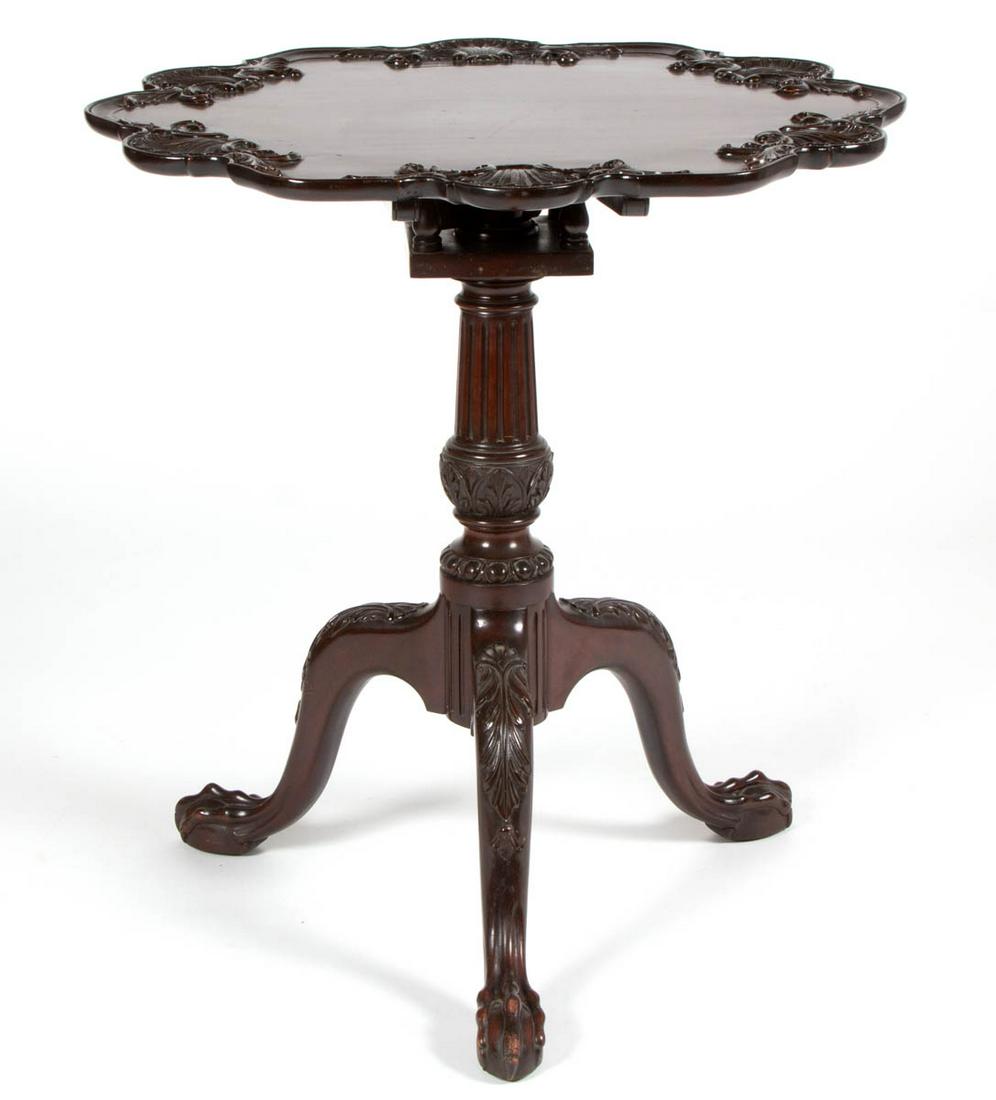 POTTHAST BROTHERS (BALTIMORE, MARYLAND) CARVED MAHOGANY: POTTHAST BROTHERS (BALTIMORE, MARYLAND) CARVED MAHOGANY TILT-TOP TEA TABLE, retaining original label, and stamped "POTTHAST", featuring shell-carved top, fluted pedestal, and cabriole legs with acanth
