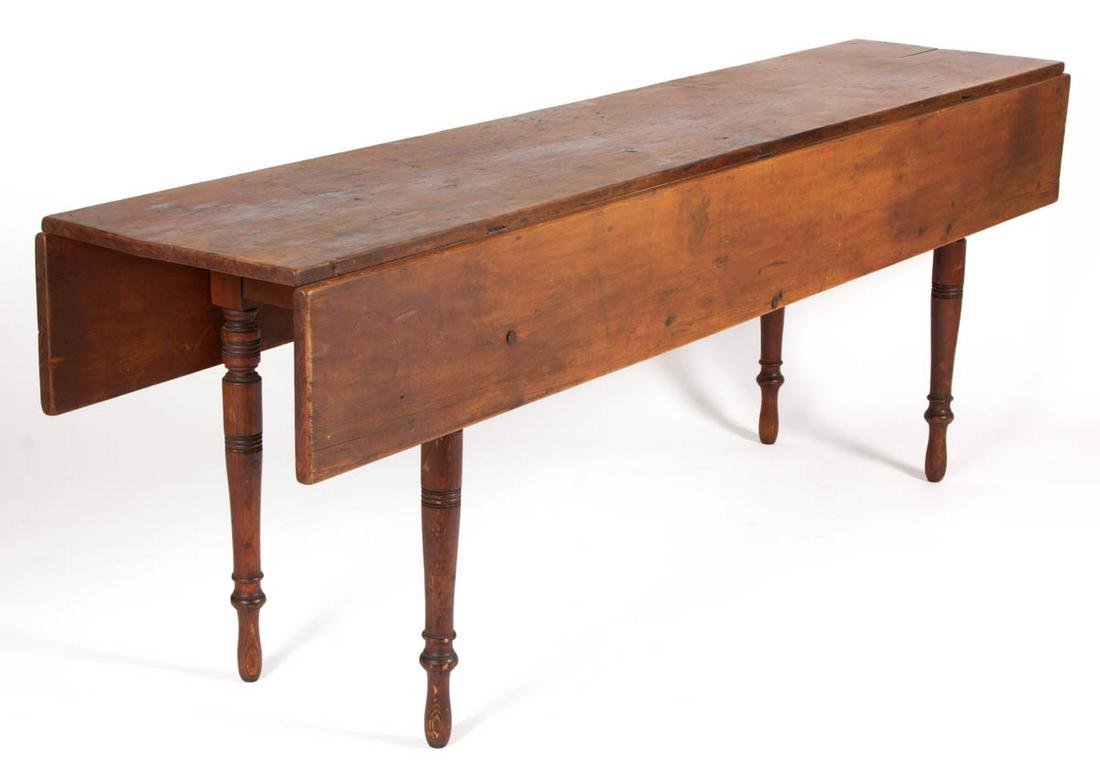 AMERICAN COUNTRY PAINTED PINE FALL-LEAF HARVEST TABLE: AMERICAN COUNTRY PAINTED PINE FALL-LEAF HARVEST TABLE, long rectangular scrubbed top set with two hinged leaves, above a plain apron having slides to each side to support the leaves, raised on turned