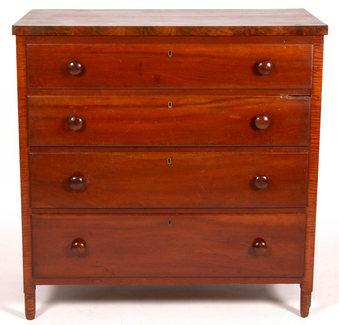 AMERICAN CHERRY AND TIGER MAPLE CHEST OF DRAWERS: AMERICAN CHERRY AND TIGER MAPLE CHEST OF DRAWERS, rectangular top with applied molding, above four molded dovetailed drawers with likely original pulls, paneled ends, raised on turned feet. Poplar sec