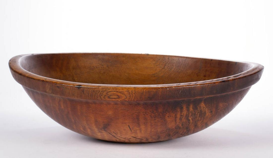 AMERICAN TURNED TIGER MAPLE BOWL: AMERICAN TURNED TIGER MAPLE BOWL, featuring molded edge and grooved foot. Old surface with rich color. 19th century. 5 3/4" H, 18 3/4" x 19 1/2". Very good overall condition, with areas of expected us