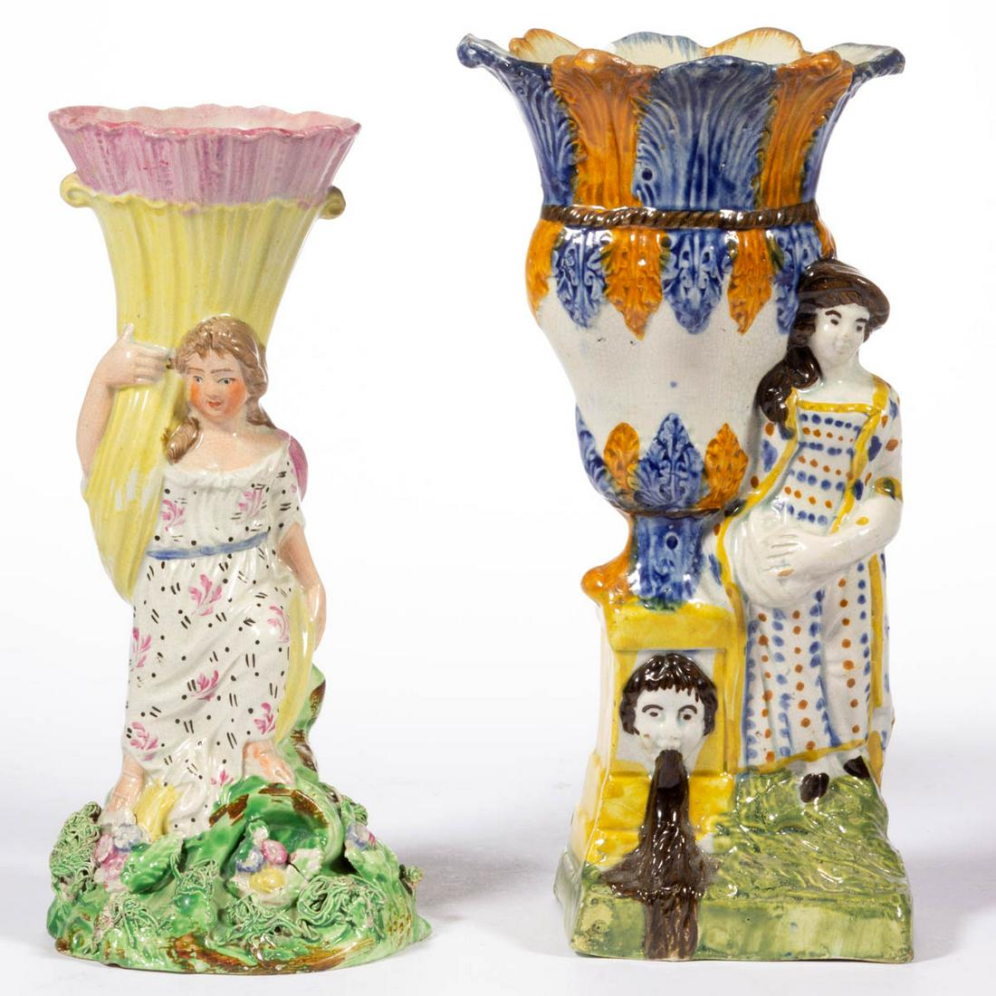 BRITISH PEARLWARE CERAMIC SPILL VASES, LOT OF TWO: BRITISH PEARLWARE CERAMIC SPILL VASES, LOT OF TWO, each decorated in the round with hand-painted polychrome decoration, comprising a Prattware-type featuring a woman standing on a square base beside a
