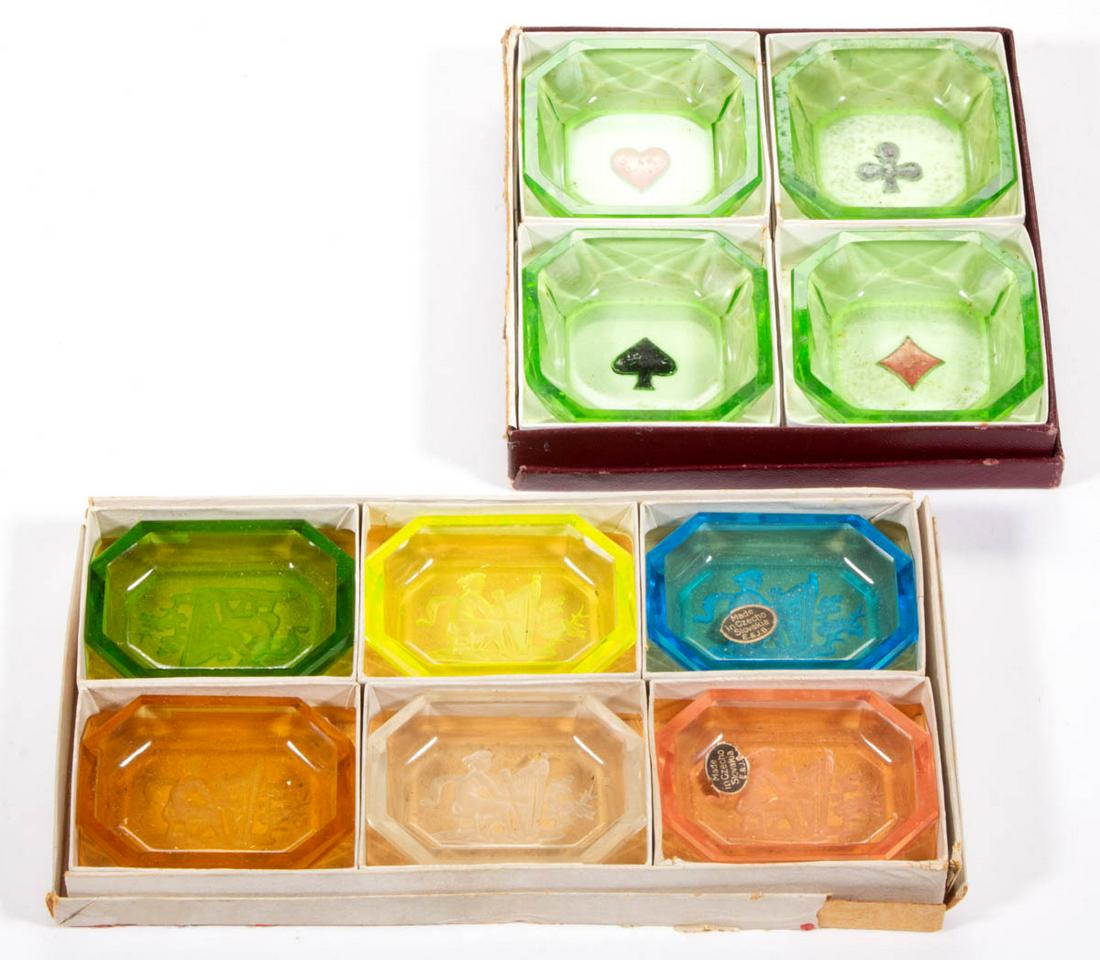 INTAGLIO GLASS OPEN SALTS, LOT OF TWO: INTAGLIO GLASS OPEN SALTS, LOT OF TWO, various colors, comprising two sets of salts in period boxes with one set comprising six examples in various colors with a woman playing a harp in each, and a se