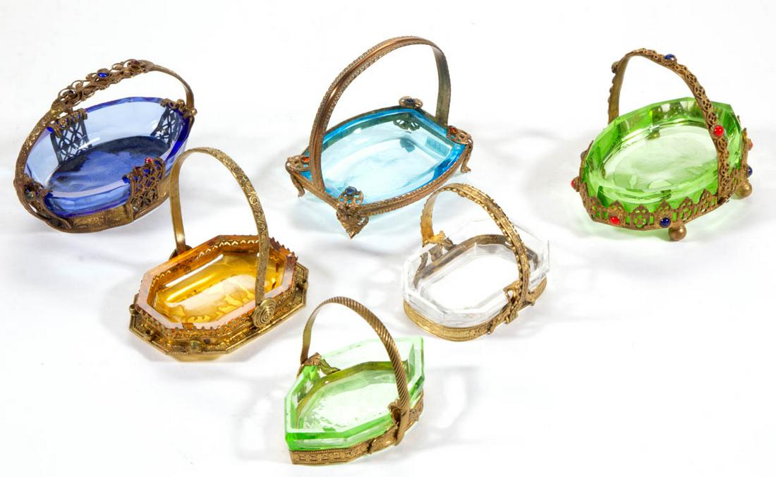 INTAGLIO GLASS OPEN SALTS IN STANDS, LOT OF SIX: INTAGLIO GLASS OPEN SALTS IN STANDS, LOT OF SIX, various colors, comprising three with a Classical scene, one floral, one elk, and one pheasant example, each being fit into a gilt filigree basket with