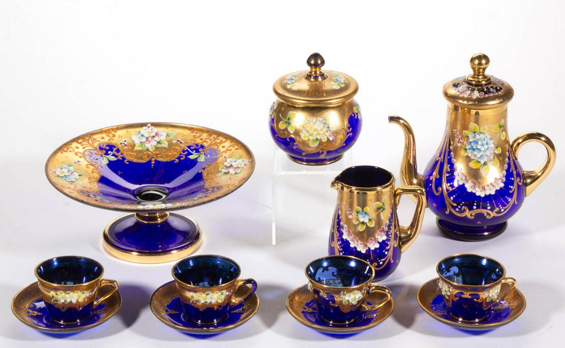 BOHEMIAN HIGH-RELIEF AND ENAMEL-DECORATED ARTICLES, LOT: BOHEMIAN HIGH-RELIEF AND ENAMEL-DECORATED ARTICLES, LOT OF 12, cobalt blue with matching polychrome-enamel decoration, comprising a teapot, a creamer, a covered sugar bowl, a compote, and four cup and
