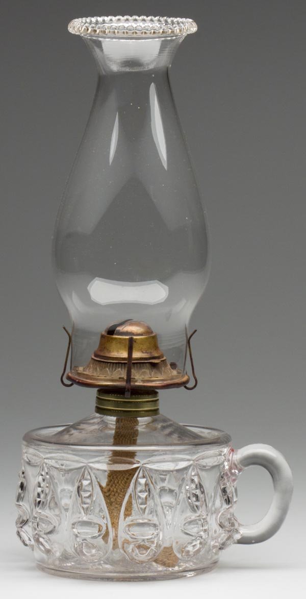 TORPEDO FINGER LAMP: TORPEDO FINGER LAMP, colorless, No. 1 Taplin-Brown collar with patent information, period slip burner and chimney. Thompson Glass Co. 3 3/4" h to top of collar, 3 7/8" dia base. Literature: Thuro I, p
