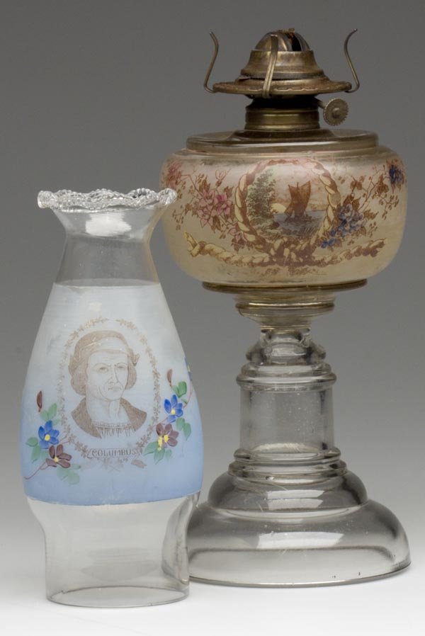 DECORATED COLUMBUS SLIP CHIMNEY: DECORATED COLUMBUS SLIP CHIMNEY, colorless, wide frosted band with light to dark blue shading, transfer and polychrome decoration, scalloped serrated top, fitted on a Princess stand lamp with nautical
