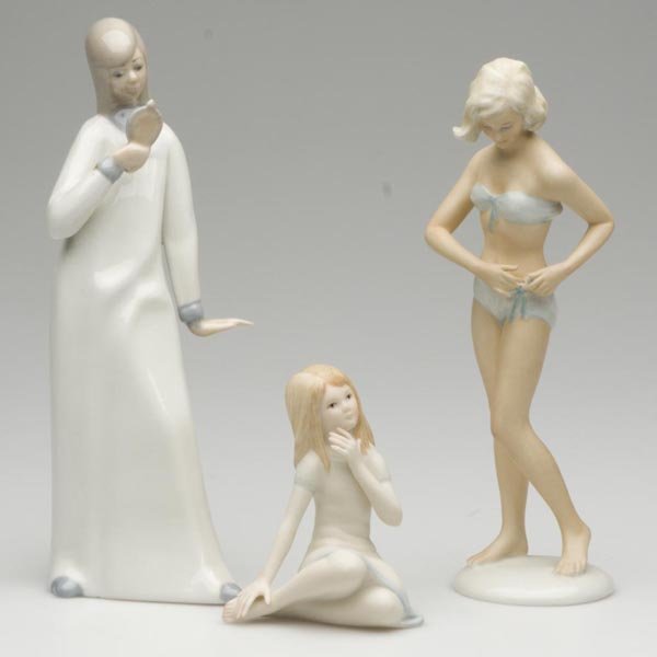 CERAMIC FIGURES, LOT OF THREE: CERAMIC FIGURES, LOT OF THREE, consisting of a German bathing beauty, impressed L. T. (?) Steiner on top of base, a Cybis seated young girl and a Casades girl with mirror. 20th century. 3 7/8" to 9" h