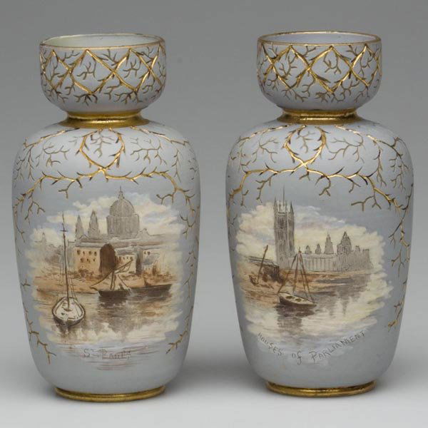 ENGLISH ART POTTERY VASES, PAIR: ENGLISH ART POTTERY VASES, PAIR, polychrome and gilt decoration, incised and hand painted scenes of London on pale blue ground incised coral branches surround the bases, illegible impressed mark and i