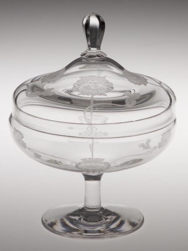 DORFLINGER KALANA POPPY COVERED CANDY DISH: DORFLINGER KALANA POPPY COVERED CANDY DISH, colorless, etched decoration, pedestaled. First quarter 20th century. 6" h overall, 5 1/4" dia overall. Provenance: From the collection of Ellen and Don Rob