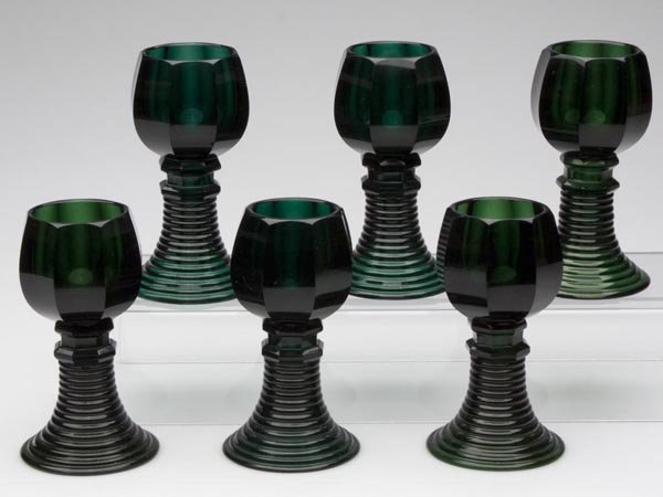 BLOWN AND MOLDED CONTINENTAL ROAMERS, SET OF SIX: BLOWN AND MOLDED CONTINENTAL ROAMERS, SET OF SIX, deep emerald green, bowl with eight cut panels, above two cut hexagonal knops, conical foot with horizontal ribs. Late 19th/early 20th century. 5 1/4"