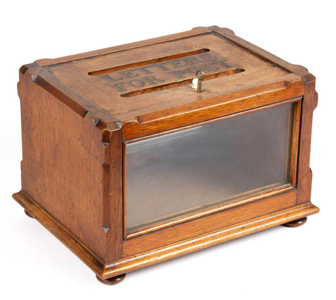 ENGLISH WALNUT COUNTER-TOP MAIL BOX: ENGLISH WALNUT COUNTER-TOP MAIL BOX, featuring hinged and locked lift lid with painted gilt over black "LETTER FOR POST", the whole raised on applied ball feet. Old surface with warm color. First quar