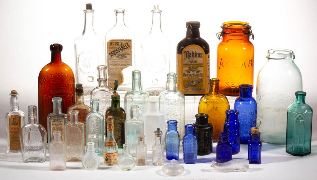 ASSORTED GLASS BOTTLES / JARS, UNCOUNTED LOT: ASSORTED GLASS BOTTLES / JARS, UNCOUNTED LOT, various colors, including two coffin-form "POISON" bottles, two "CHELF'S/CELERY-CAFFEIN" bottles, a "WARNER'S/SAFE/KIDNEY & LIVER/CURE" bottle, a "PROTECT