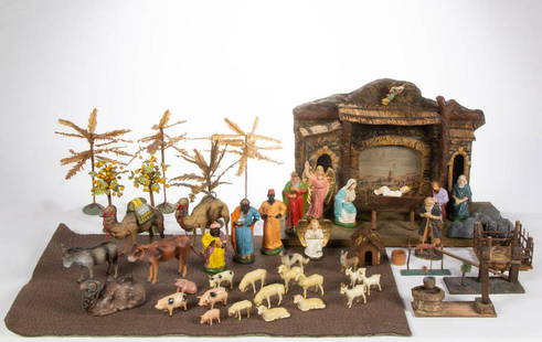 VINTAGE GERMAN CHRISTMAS NATIVITY SET: VINTAGE GERMAN CHRISTMAS NATIVITY SET, more than 30 pieces, made of composition, papier-mache, and wood with polychrome-painted decoration, including a stable, palm trees, figures, and animals. Most w