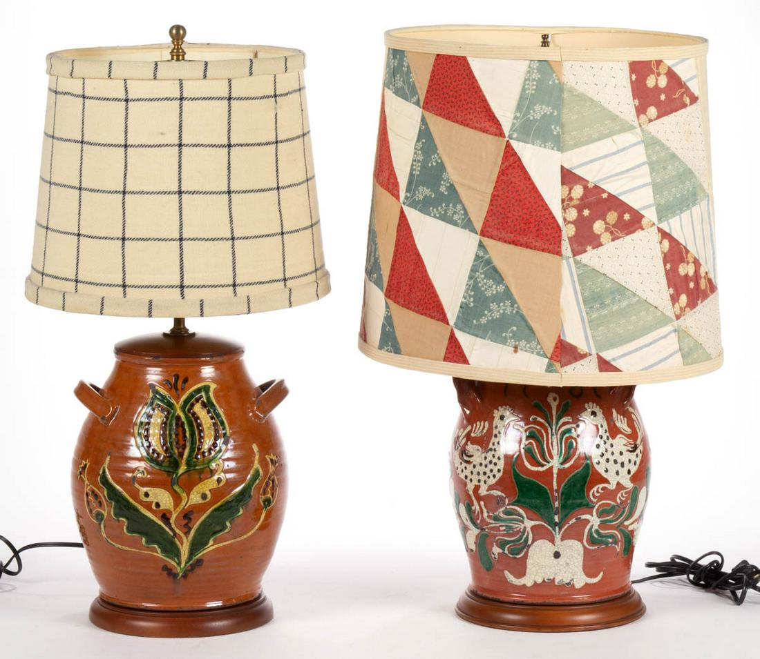 REPRODUCTION EARTHENWARE / REDWARE JAR ELECTRIC LAMPS,: REPRODUCTION EARTHENWARE / REDWARE JAR ELECTRIC LAMPS, LOT OF TWO, lead-glazed with slip-trailed decorations, each of ovoid form with applied horizontal handles and wooden bases and tops, with shades,