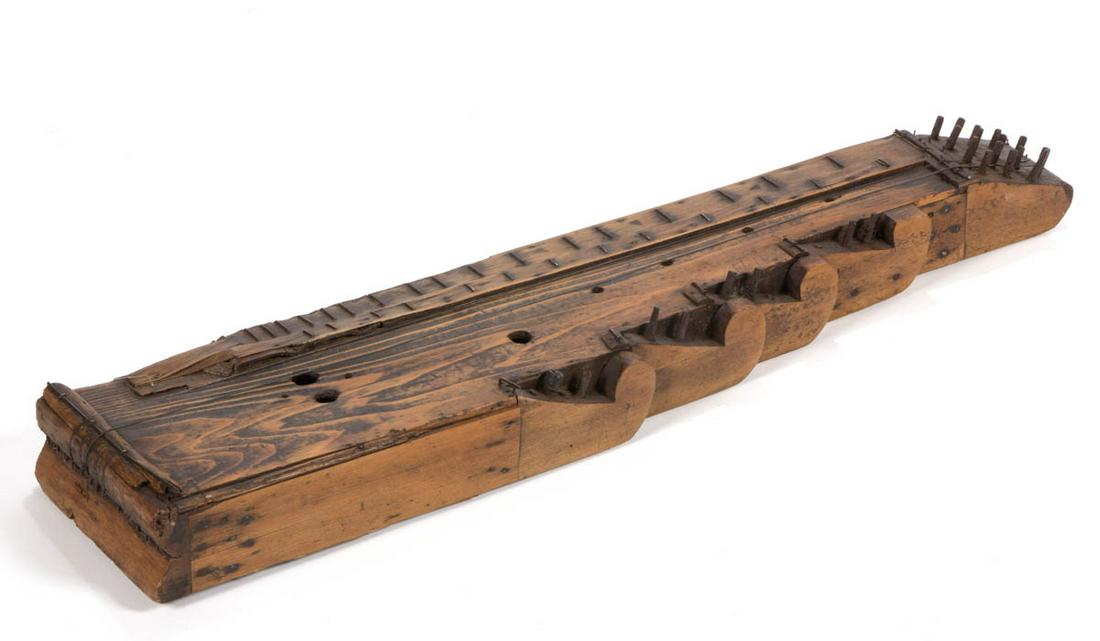 CONTINENTAL WOODEN SCHEITHOLT / DULCIMER: CONTINENTAL WOODEN SCHEITHOLT / DULCIMER, unknown completeness, fitted for 23 strings. Old surface with warm color. 19th century. 32" L. Provenance: Private collection of Wallace Gusler, Williamsburg,