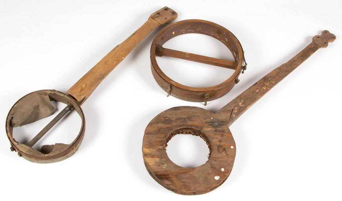 APPALACHIAN CARVED FOLK ART BANJOS, LOT OF TWO: APPALACHIAN CARVED FOLK ART BANJOS, LOT OF TWO, Together with a banjo head. Three pieces total. Possibly Tennessee. Circa 1920. 27" and 37 1/4" L. Provenance: Private collection of Wallace Gusler, Wil