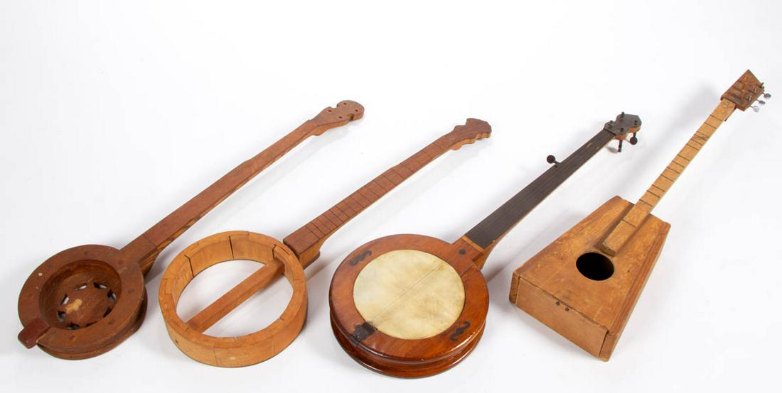 APPALACHIAN CARVED FOLK ART BANJOS, LOT OF FOUR: APPALACHIAN CARVED FOLK ART BANJOS, LOT OF FOUR, unfinished, each with original surface with warm color. Mid 20th century. One 34 1/2" L. Provenance: Private collection of Wallace Gusler, Williamsburg