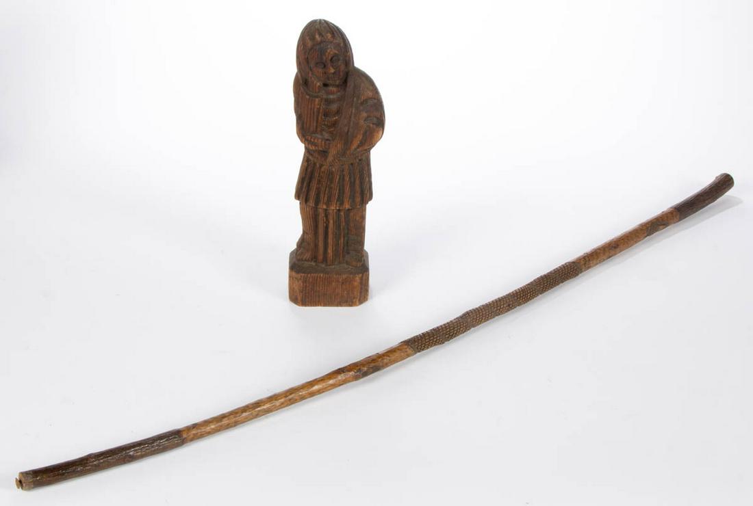 AMERICAN FOLK ART CARVED WALKING STICK / CANE: AMERICAN FOLK ART CARVED WALKING STICK / CANE, carved for "MISS PATTI / R.N." with an acorn decoration. Original dry natural surface. Together with a carved cedar figure holding a book. Two pieces tot