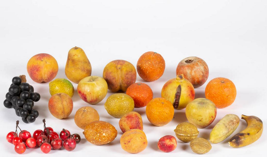 ASSORTED FIGURAL STONE FRUIT, LOT OF 29 PIECES: ASSORTED FIGURAL STONE FRUIT, LOT OF 29 PIECES, including cherries, grapes, banana, oranges, and walnut examples. Second half 19th/early 20th century. Various sizes.Provenance: From the Rodney Maze co
