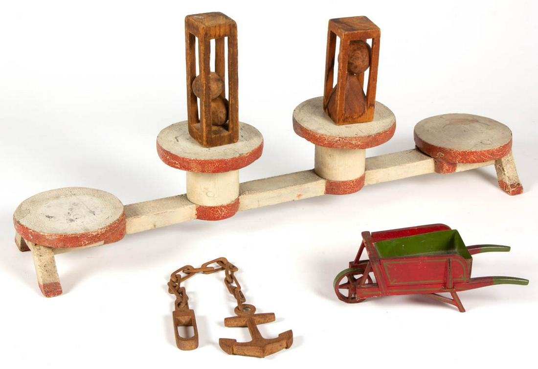 ASSORTED FOLK ART FIGURAL CARVED WOODEN ARTICLES, LOT: ASSORTED FOLK ART FIGURAL CARVED WOODEN ARTICLES, LOT OF FIVE, two paint-decorated examples including a wheelbarrow with sheet-iron/tin interior bed lining and an oblong display stand with four raised