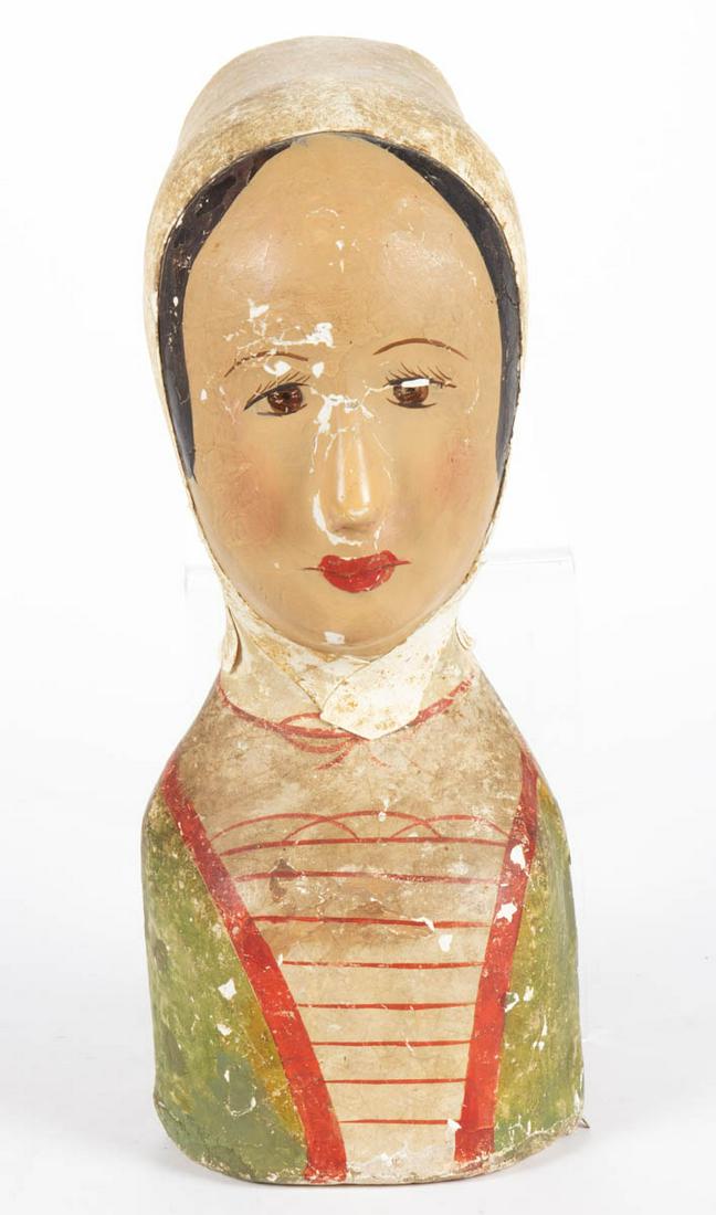 FRENCH PAINTED PAPIER-MACHE DISPLAY MILLINERY HEAD /: FRENCH PAINTED PAPIER-MACHE DISPLAY MILLINERY HEAD / MAROTTE, depicting a bust of a woman with painted features and leather white bonnet. Late 19th/early 20th century. 15 1/2" HOA. Provenance: From a 
