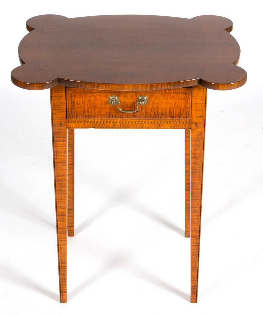 GEORGE BESHORE (PENNSYLVANIA, 1923-2009) BENCHMADE: GEORGE BESHORE (PENNSYLVANIA, 1923-2009) BENCHMADE FEDERAL-STYLE INLAID TIGER MAPLE STAND TABLE, the scalloped top with turreted corners over a single thumb-molded drawer raised on square-tapered legs