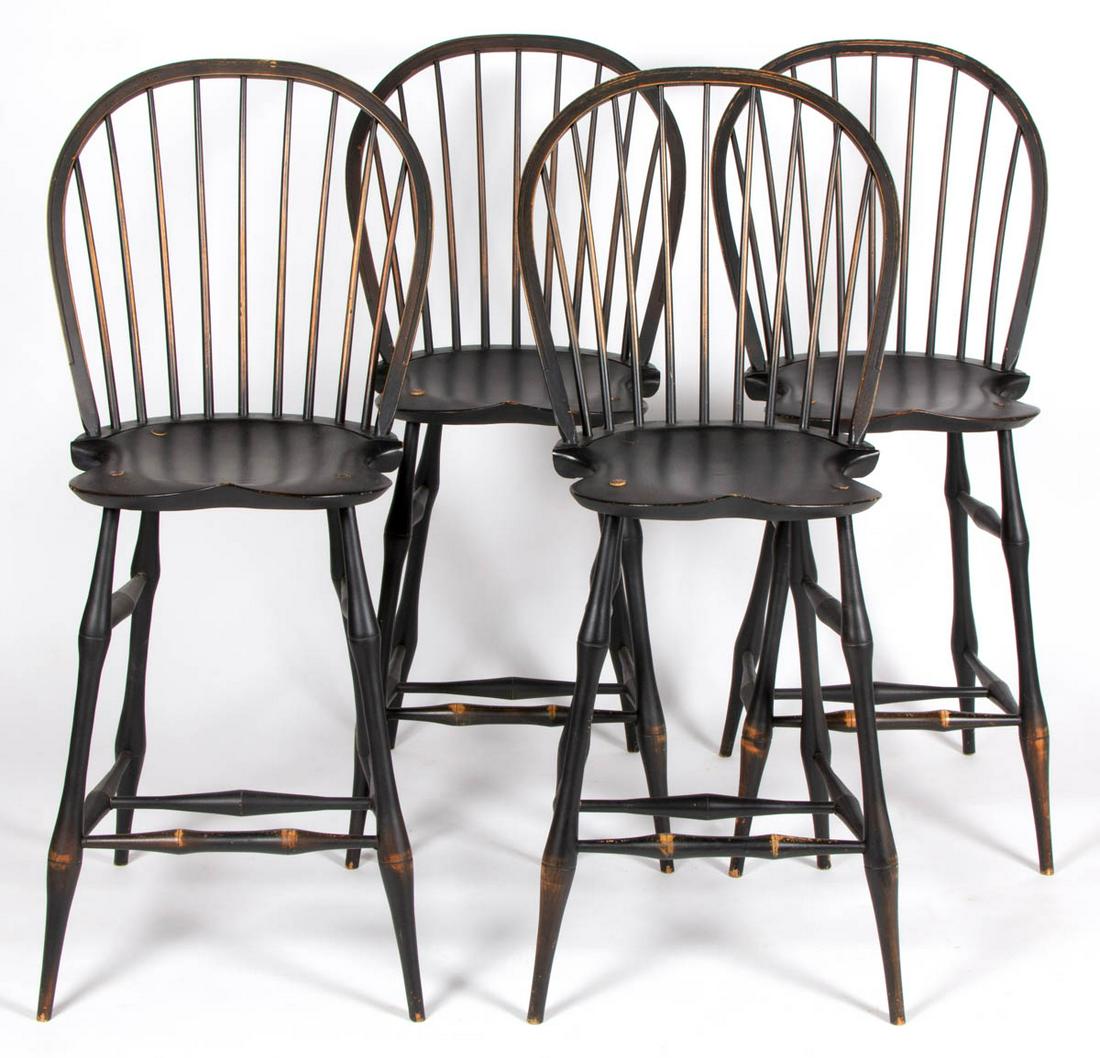 ALEX PIFER'S THE SERAPH WINDSOR-STYLE BOW BACK BAR: ALEX PIFER'S THE SERAPH WINDSOR-STYLE BOW BACK BAR STOOLS, SET OF FOUR, each stamped to the underside "The Seraph", in a distressed black-painted surface. Late 20th century. 45" HOA, 27 1/4" H seat, 1