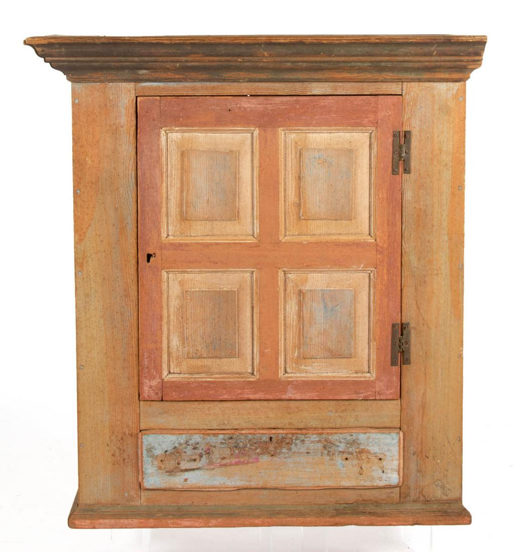 SHENANDOAH VALLEY OF VIRGINIA YELLOW PINE HANGING: SHENANDOAH VALLEY OF VIRGINIA YELLOW PINE HANGING CUPBOARD, applied cornice, above hinged raised-panel door concealing a single fixed interior shelf, over single dovetailed drawer lacking knobs, retai