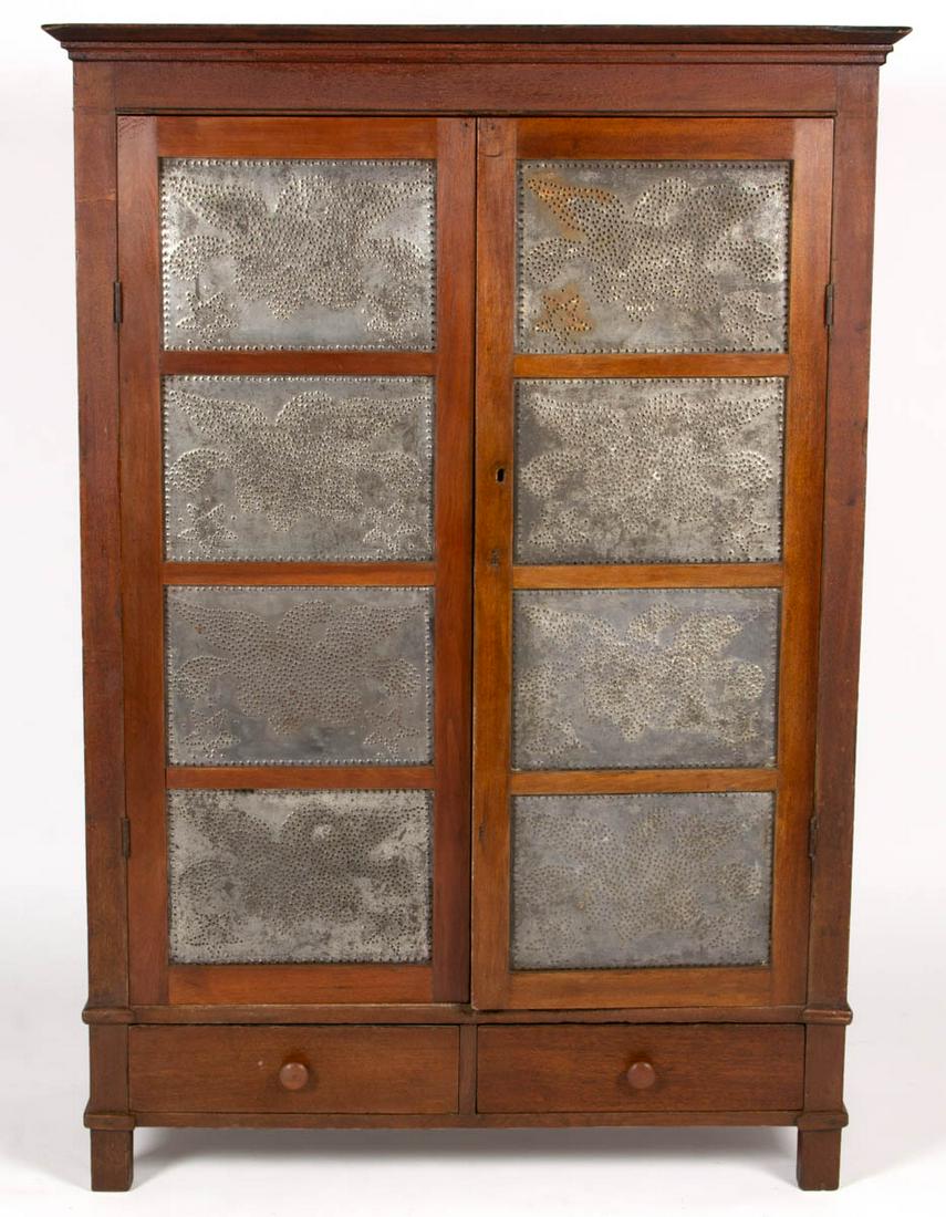 AMERICAN WALNUT PUNCHED-TIN-PANELED FOOD / PIE SAFE: AMERICAN WALNUT PUNCHED-TIN-PANELED FOOD / PIE SAFE, rectangular two-board top over two hinged doors concealing yellow-painted interior with three shelves, over two short dovetailed drawers, raised on