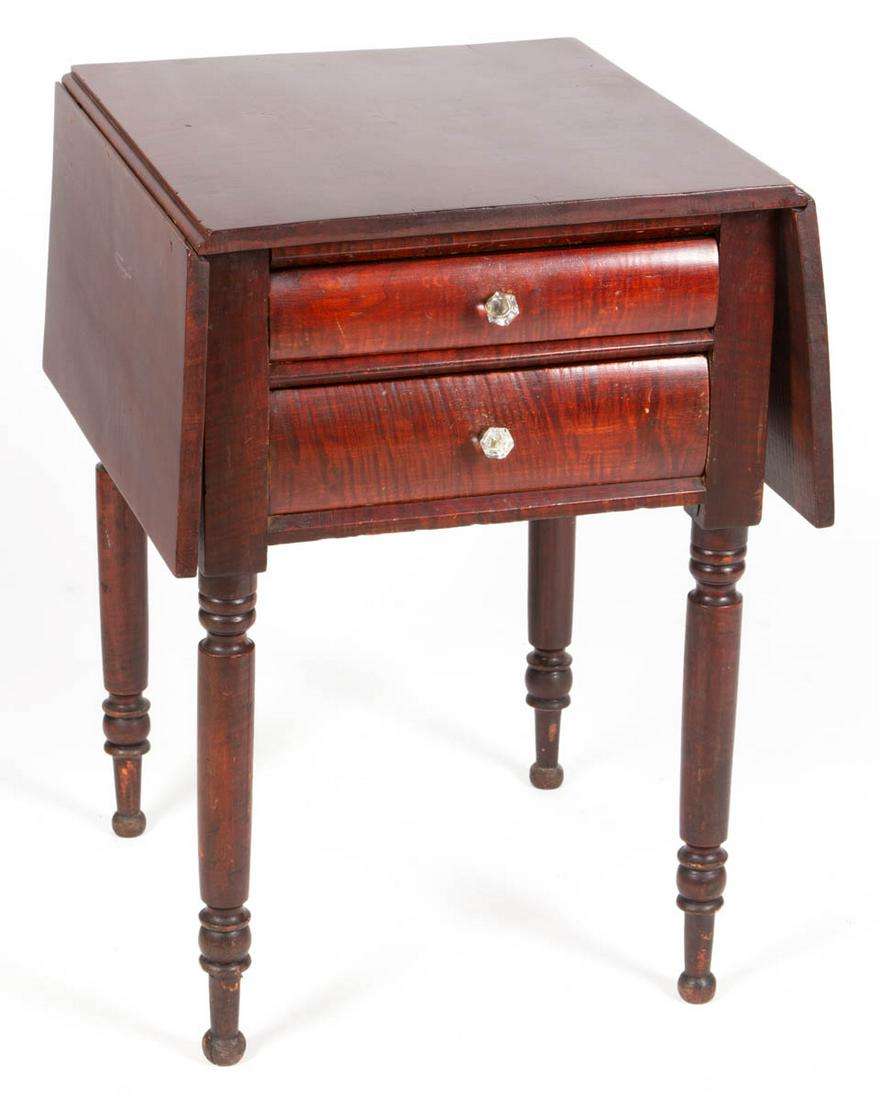 AMERICAN FIGURED TIGER MAPLE STAND TABLE: AMERICAN FIGURED TIGER MAPLE STAND TABLE, rectangular top set with two hinged leaves above two dovetailed drawers with likely original knobs, upper drawer with dividers, raised on turned legs terminat