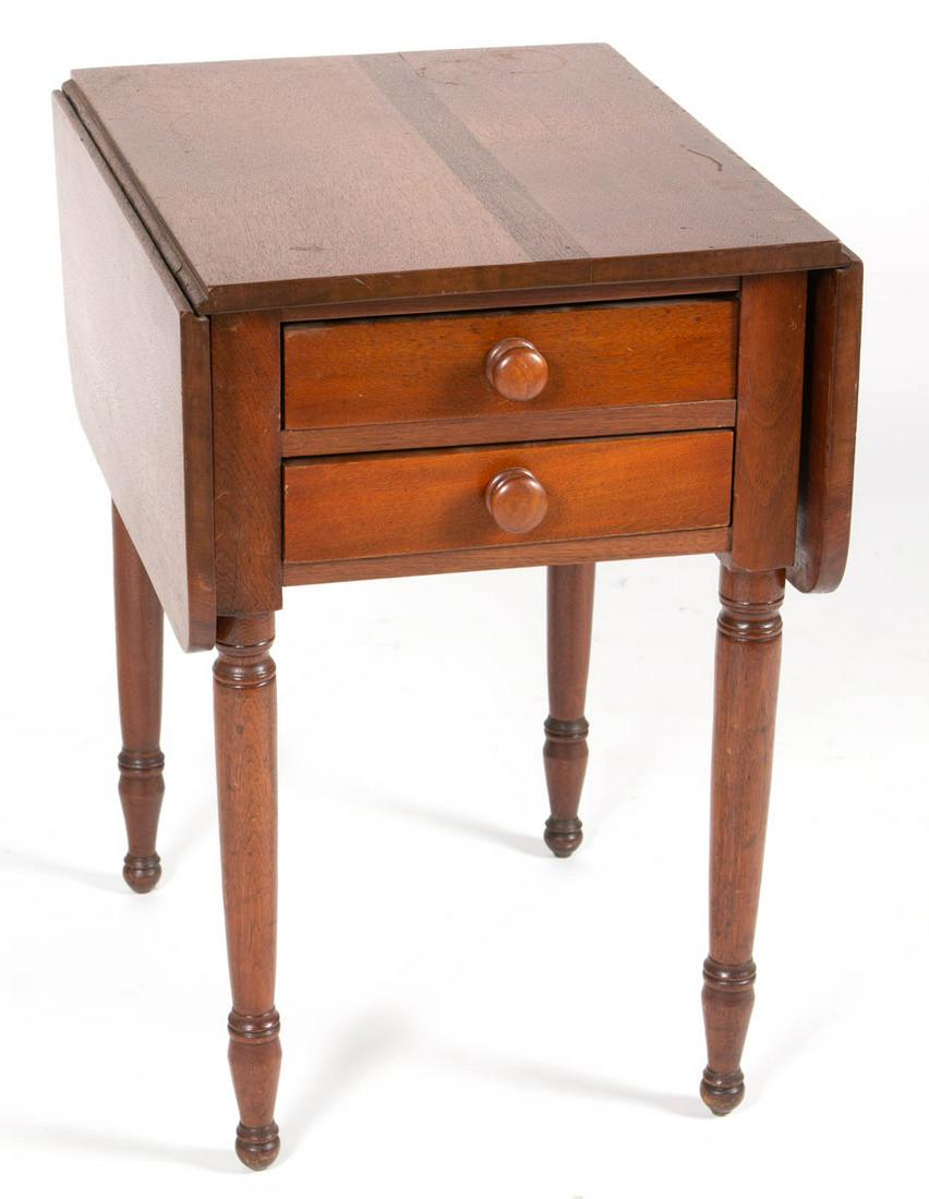 AMERICAN WALNUT STAND TABLE: AMERICAN WALNUT STAND TABLE, rectangular top fitted with two hinged fall leaves, above two dovetailed drawers with likely original pulls, raised on turned legs. Poplar secondary wood. Old refinished s