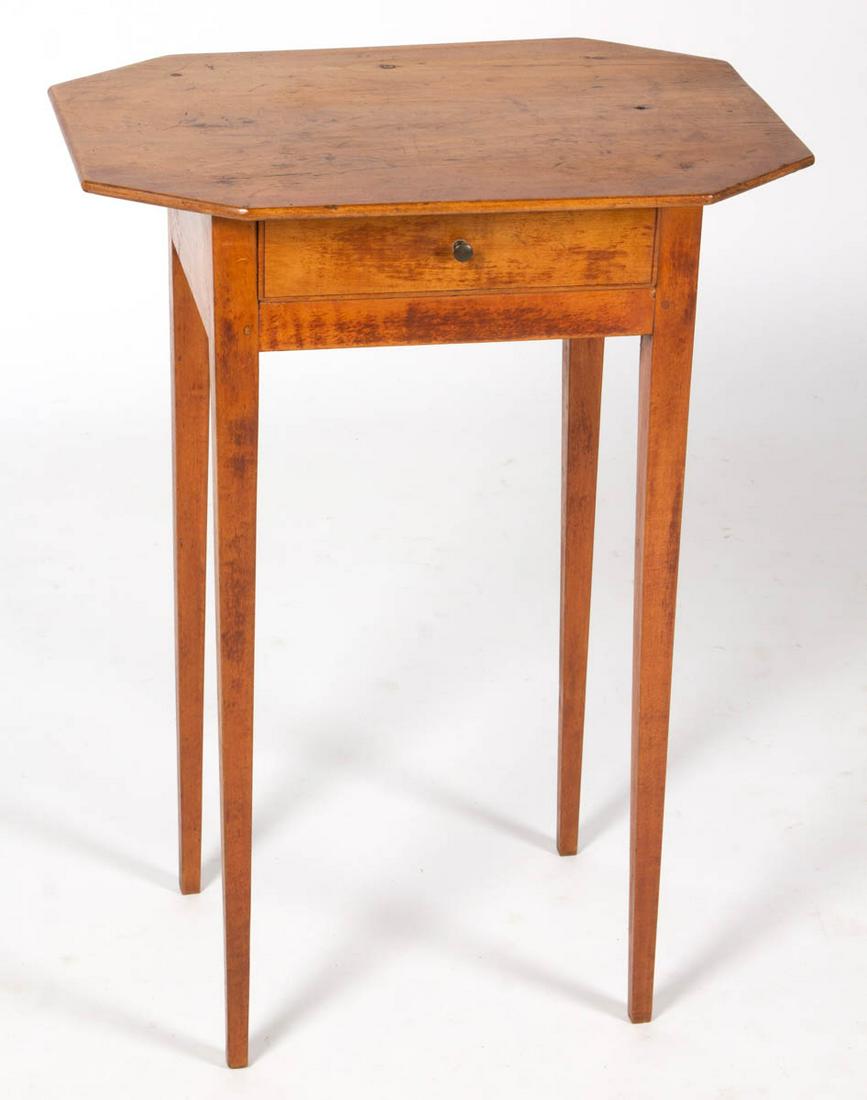 AMERICAN CHERRY STAND TABLE: AMERICAN CHERRY STAND TABLE, octagonal top over single dovetailed drawer with period brass pull, raised on square tapered legs. Pine secondary wood. Old refinished surface with mild color. Second quar