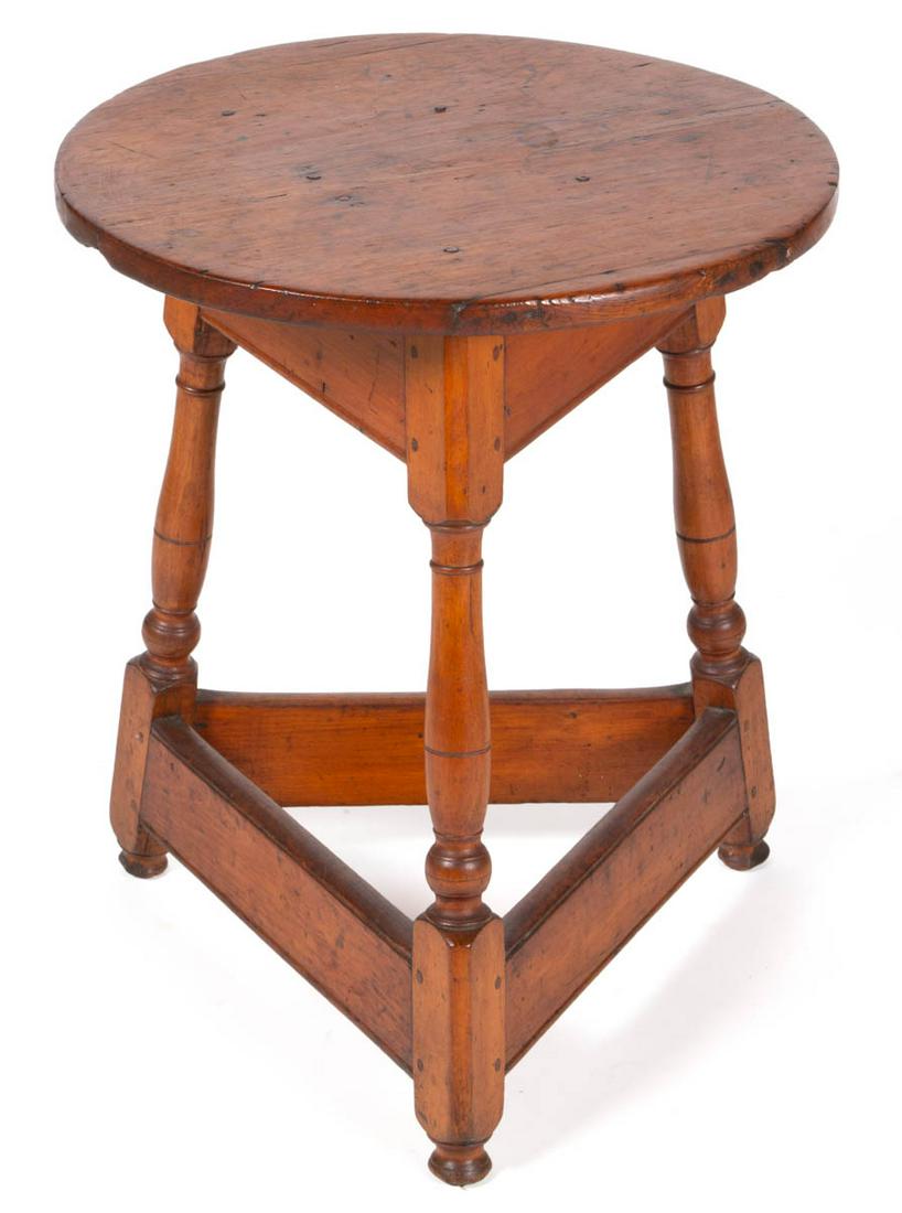 COUNTRY PINE TAVERN TABLE: COUNTRY PINE TAVERN TABLE, circular top, ring turned legs joined by stretcher, retains old collection label to underside of top board. Old refinished surface with warm color. Probably 19th century. 25