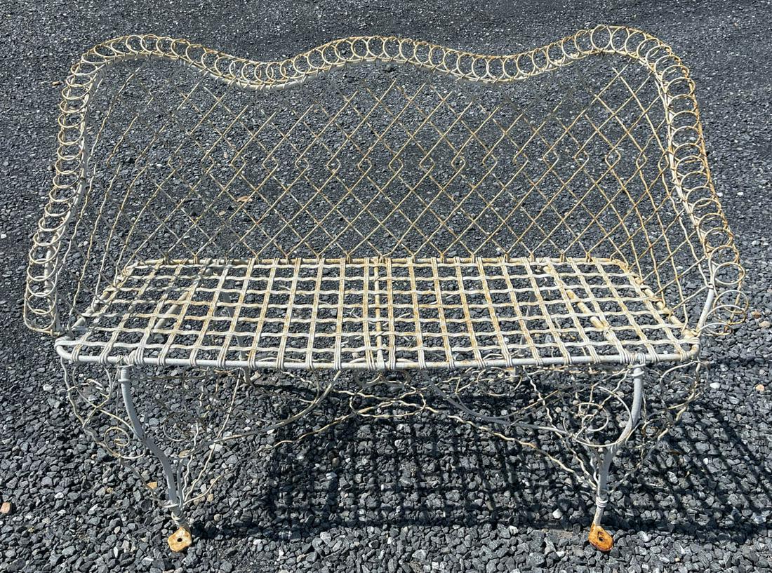 VICTORIAN PAINTED METAL WIRE GARDEN BENCH: VICTORIAN PAINTED METAL WIRE GARDEN BENCH, open-work back and seat with scrolled elements to base and crest rail, retaining an old white-painted surface. Late 19th/first quarter 20th century. 34" HOA,
