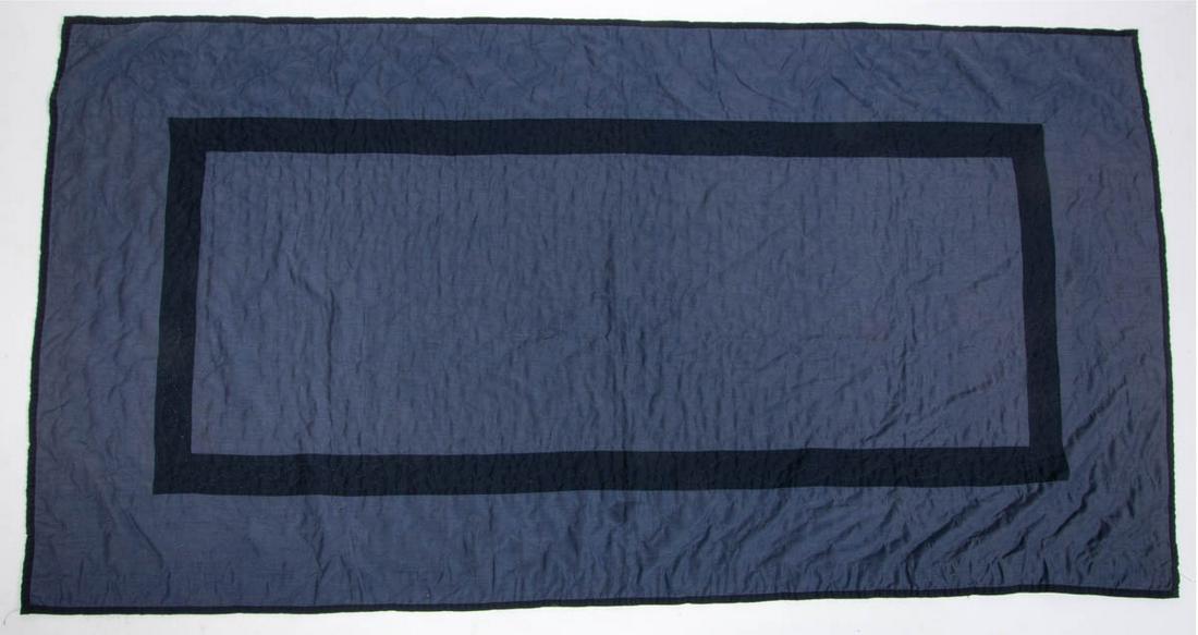 AMERICAN AMISH PIECED CRIB QUILT: AMERICAN AMISH PIECED CRIB QUILT, hand- and machine-stitched, medium and dark blue plain fabrics, rectangular center with diagonal grid quilting, inner border with chain quilting, outer border with sc