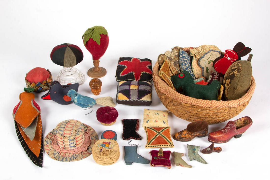 ASSORTED MATERIALS SEWING / NEEDLEWORKING ARTICLES,: ASSORTED MATERIALS SEWING / NEEDLEWORKING ARTICLES, UNCOUNTED LOT, approximately 35 pieces, comprising pin cushions, including six pillow-form examples, six boot/shoe examples in cloth, leather and de