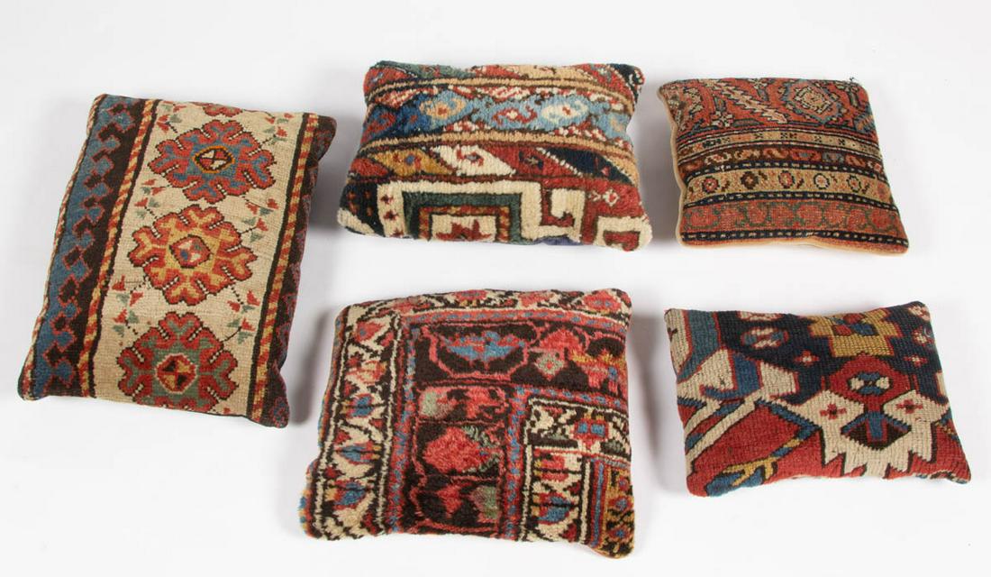 ORIENTAL / PERSIAN RUG FRAGMENT PILLOWS, LOT OF FIVE: ORIENTAL / PERSIAN RUG FRAGMENT PILLOWS, LOT OF FIVE, including Caucasian and others. 20th century. Largest 17 1/4" x 13". Provenance: The collection of the late Theodore "Ted" and Alvina Breckel, Ole