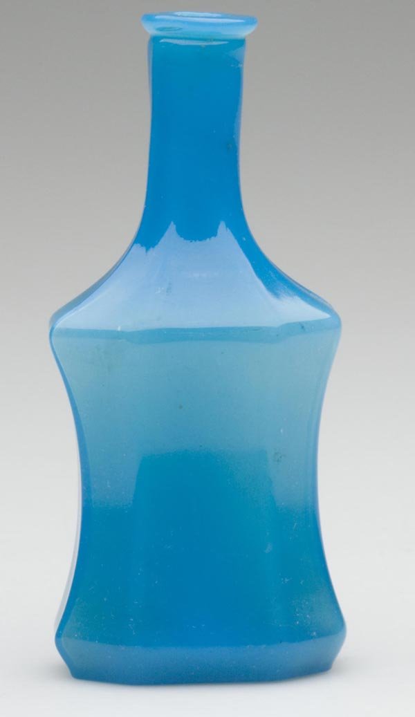 BLOWN-MOLDED PANELED COMMERCIAL COLOGNE BOTTLE: BLOWN-MOLDED PANELED COMMERCIAL COLOGNE BOTTLE, translucent powder blue with light opalescence, concave-sided form with eight panels, crude tooled lip, and plain base. Boston & Sandwich Glass Co. and 