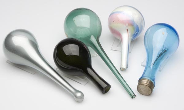 FIVE ASSORTED BLOWN DARNING BALLS: FIVE ASSORTED BLOWN DARNING BALLS, various colors, comprised of one mold-blown example with a screw cap, and four free-blown examples, two with a powder-coated interior, three with open ends. United S