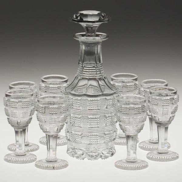 PRESSED CHECKERED DIAMOND POINT NINE-PIECE LIQUOR : PRESSED CHECKERED DIAMOND POINT NINE-PIECE LIQUOR SET, colorless, comprised of a half-pint decanter and eight stemmed glasses, each article with polished elements and a small polished pontil mark, dec