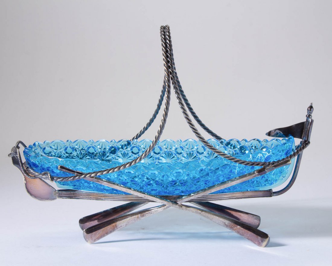 HOBBS NO. 101 / DAISY AND BUTTON NOVELTY YACHT DISH: HOBBS NO. 101 / DAISY AND BUTTON NOVELTY YACHT DISH, Sapphire/blue. fitted into a figural quadruple-plate ship stand. Hobbs, Brockunier & Co. Circa 1884. Stand: 7 3/4" HOA, 10 3/4" LOA. Dish: 3 1/2" x