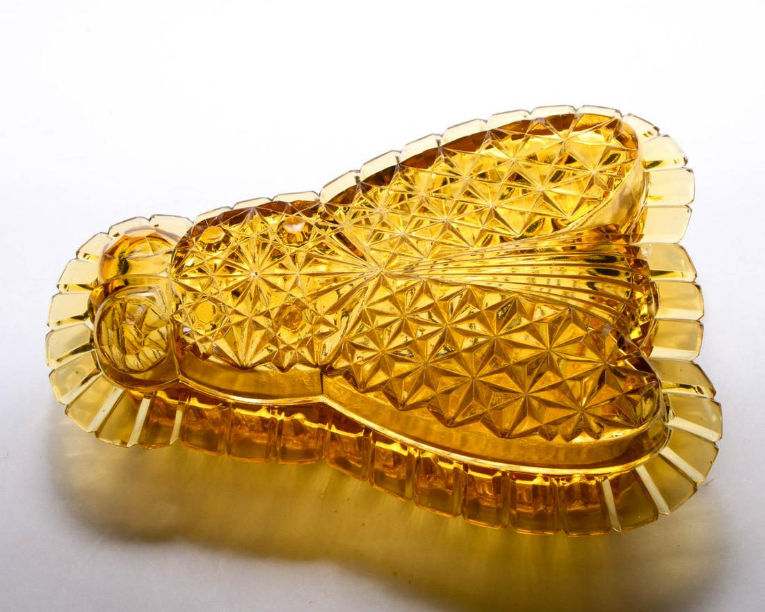 NOVELTY FLY COVERED DISH: NOVELTY FLY COVERED DISH, amber. Maker unverified. Circa 1880s. 2 3/8" H, 8 1/4" LOA.Literature: Sanford - Victorian Glass Novelties, p. 110, middle.Provenance: From the Briggs - Richardson Collection