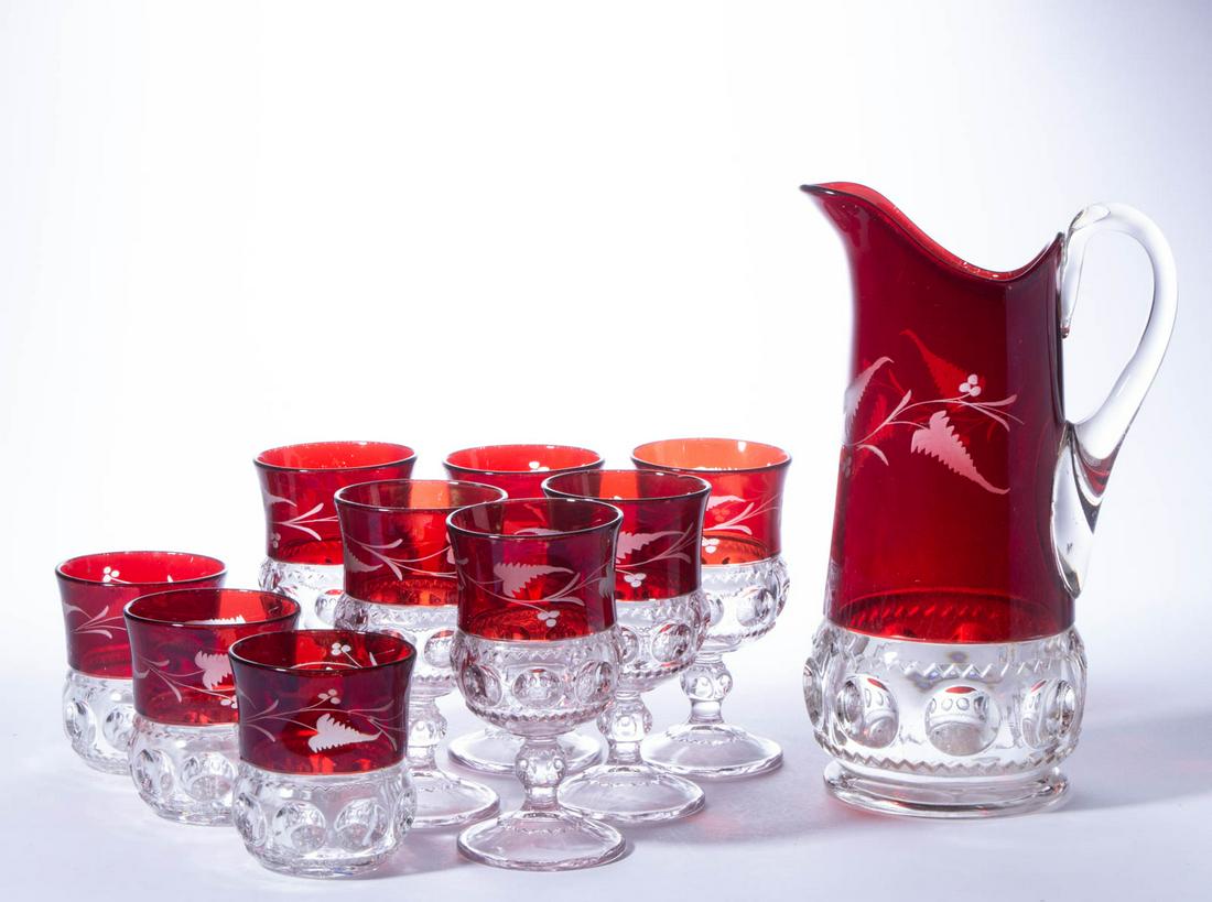 KING'S CROWN / EXCELSIOR (OMN) - RUBY-STAINED DRINKING: KING'S CROWN / EXCELSIOR (OMN) - RUBY-STAINED DRINKING ARTICLES, LOT OF TEN, colorless with matching engraved decoration, comprising a tankard-form pitcher, three tumblers, and six goblets. Adams & Co
