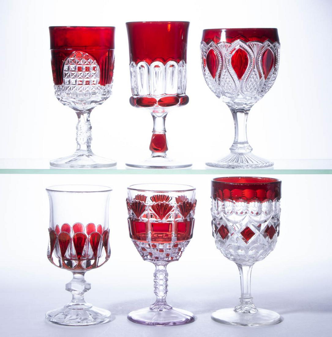 ASSORTED EAPG - RUBY-STAINED GOBLETS, LOT OF SIX: ASSORTED EAPG - RUBY-STAINED GOBLETS, LOT OF SIX, colorless, including a Crystal Wedding, a Nail, a New Jersey, and a Block and Fan. Late 19th/first quarter 20th century. 5 7/8" to 6 1/2" H. Provenanc