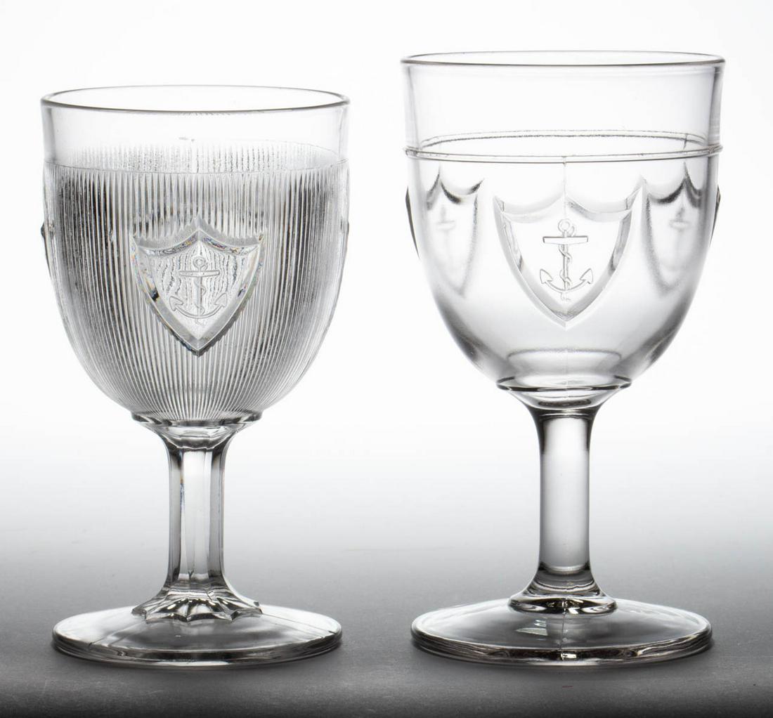 ASSORTED EAPG GOBLETS, LOT OF TWO: ASSORTED EAPG GOBLETS, LOT OF TWO, colorless, comprising a large Rhode Island and a Shield and Anchor. Fourth quarter 19th century. 5 7/8" and 6 1/4" H. Provenance: From the Briggs - Richardson Collec